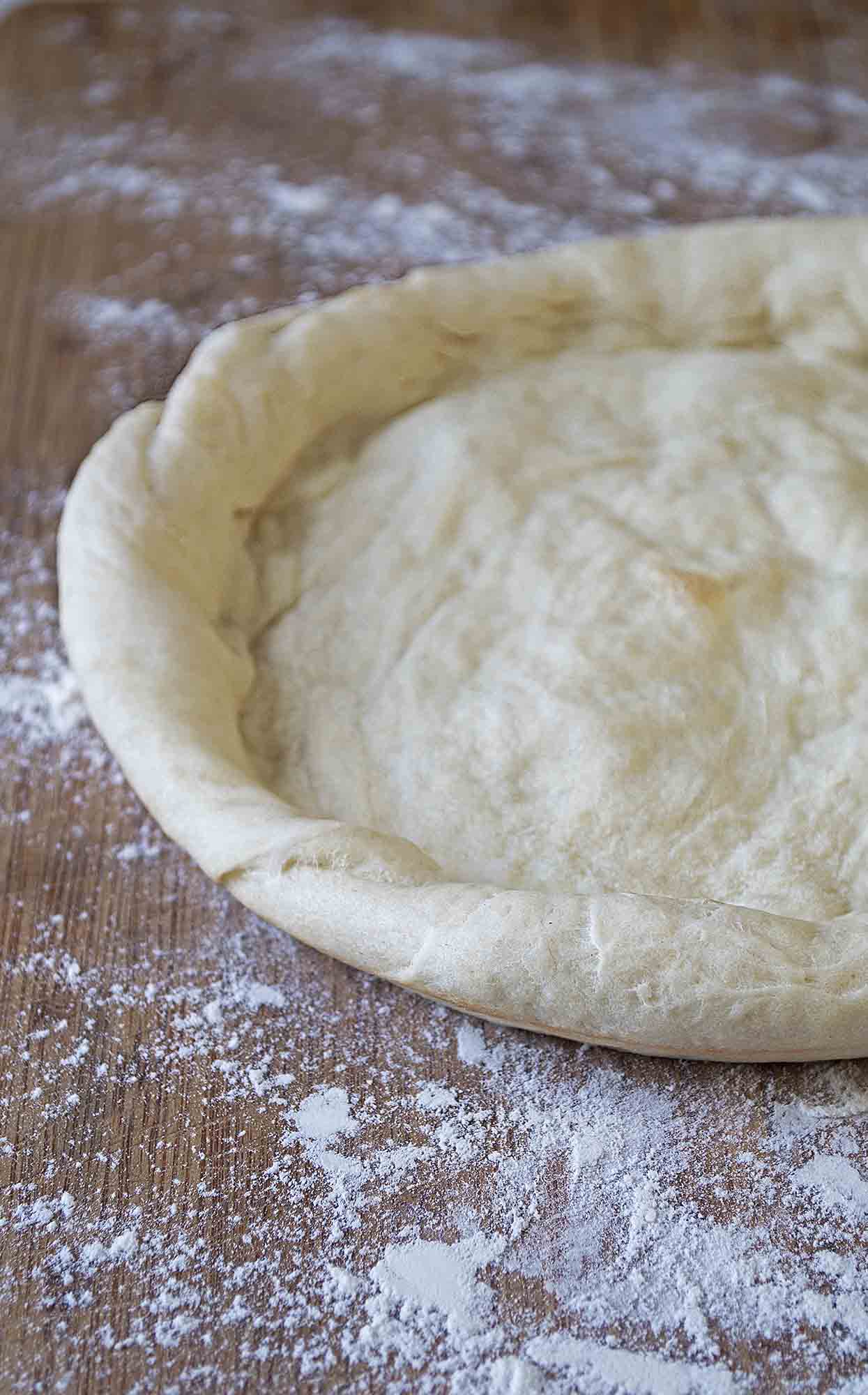 Pizza Crust made with homemade pizza dough